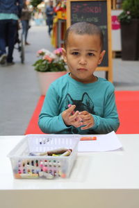 Portrait of boy holding crayon