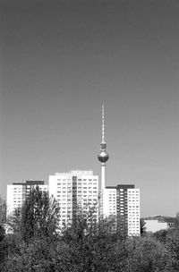 Low angle view of communications tower against sky