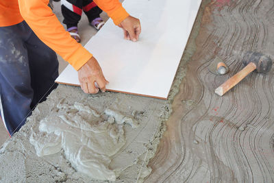 High angle view of people working on table