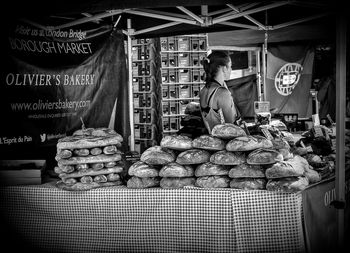 Man for sale at market stall