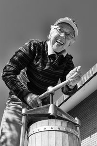 Low angle portrait of man standing outdoors