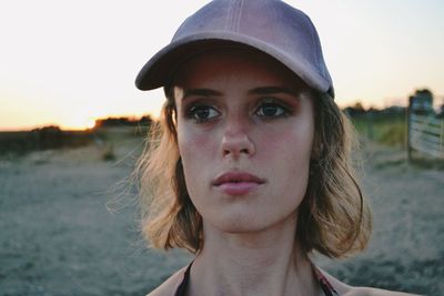 Beautiful woman against sky during sunset