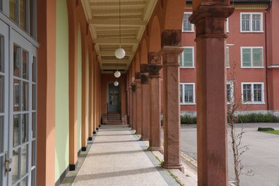 Empty corridor along buildings