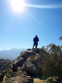 Full length of man on rock against sky