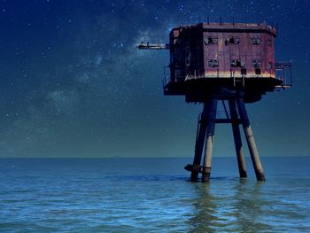 Scenic view of a seafort against sky at night