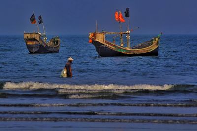 Boat in sea against sky