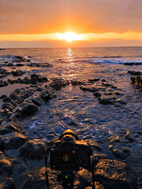 Scenic view of sea against sky during sunset