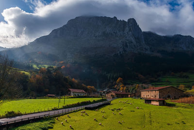 Scenic view of landscape and mountains against sky