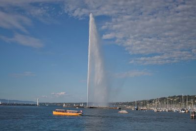 Water jet in the lake and taxi boat