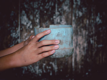 Close-up of hand holding drink