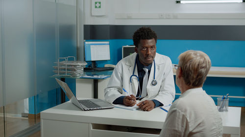 Doctor examining patient at hospital