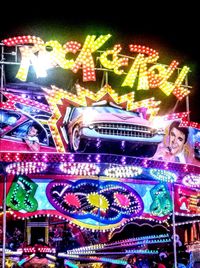 Illuminated carousel in amusement park