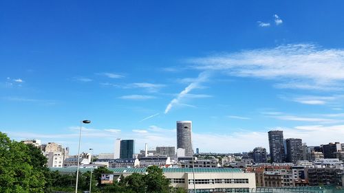 Cityscape against blue sky