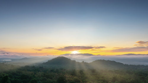 Scenic view of mountains against sky during sunset