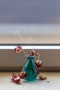 Close-up of red flowers on table