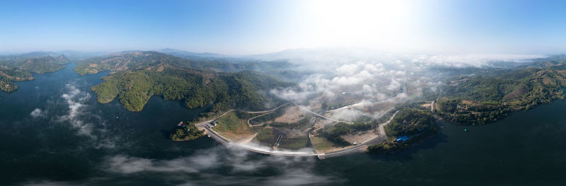 Beautiful panoramic landscape aerial view mae suai dam or reservoir and fog with blue sky background 