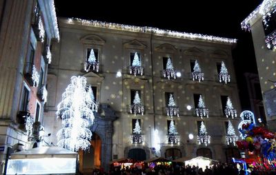 Low angle view of illuminated building at night