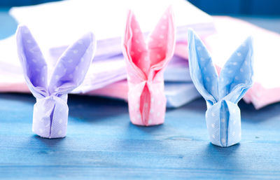 Close-up of blue tied with spoon on table