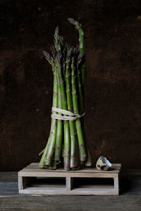 Close-up of vegetables on table against black background