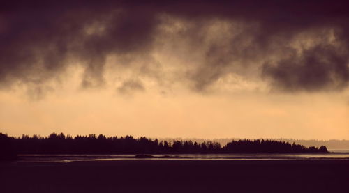 Scenic view of silhouette landscape against sky at sunset