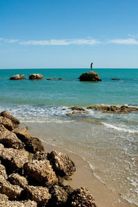 Scenic view of shore against sky