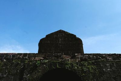 Low angle view of old ruin against clear sky