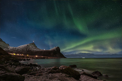 Scenic view of sea against sky at night