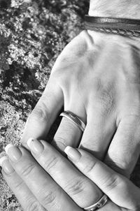 Close-up of man holding hands