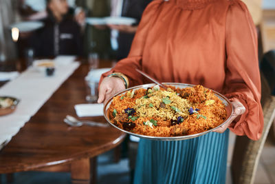 Midsection of woman having food