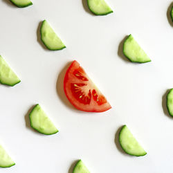 High angle view of chopped vegetables against white background