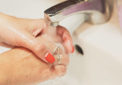 Close-up of woman holding hands