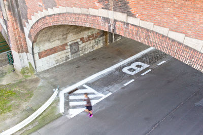 Blurred motion of man running in road