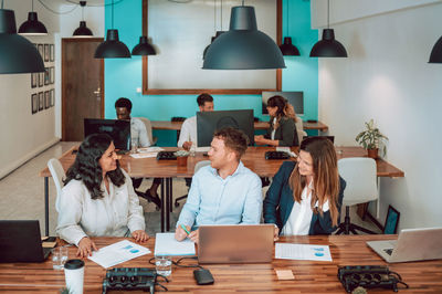 Colleagues working together in office