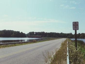 View of road sign against sky