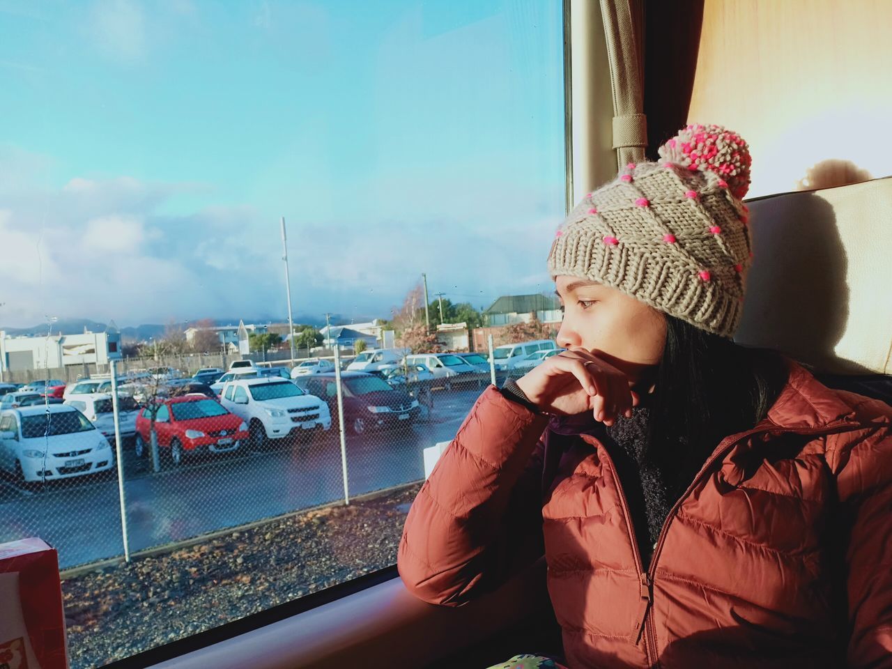 WOMAN LOOKING AT BOAT AGAINST SKY IN WINTER