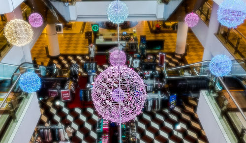 Low angle view of illuminated lanterns hanging in store