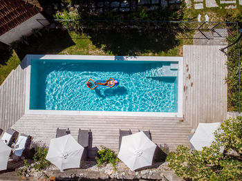 Woman relaxing in swimming pool