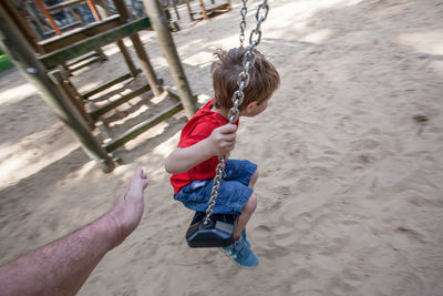 High angle view of girl holding camera