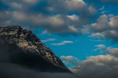 Scenic view of landscape against cloudy sky