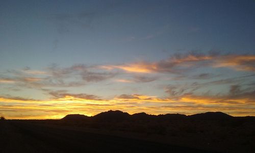 Scenic view of mountains at sunset