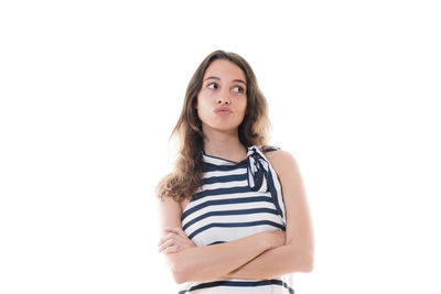 Portrait of beautiful young woman against white background