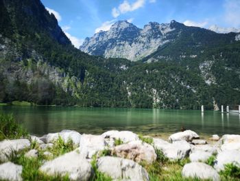 Scenic view of lake and mountains against sky