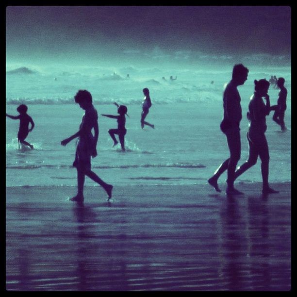 transfer print, lifestyles, leisure activity, auto post production filter, water, beach, sea, men, togetherness, full length, enjoyment, silhouette, person, sky, horizon over water, shore, large group of people, walking, vacations