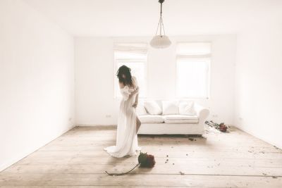 Young woman sitting at home