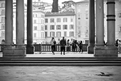 Group of people on building in city