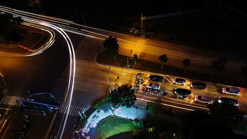 High angle view of light trails on road at night