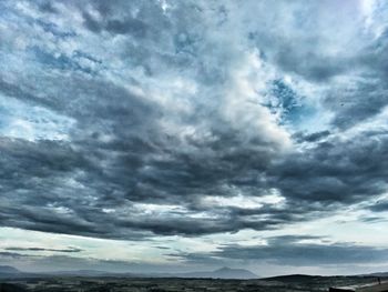 Scenic view of landscape against cloudy sky