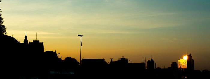 Silhouette of city at sunset