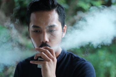 Man smoking electronic cigarette