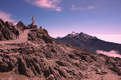 Scenic view of mountains against cloudy sky